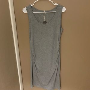 Fitted, ribbed, sleeveless maternity dress.